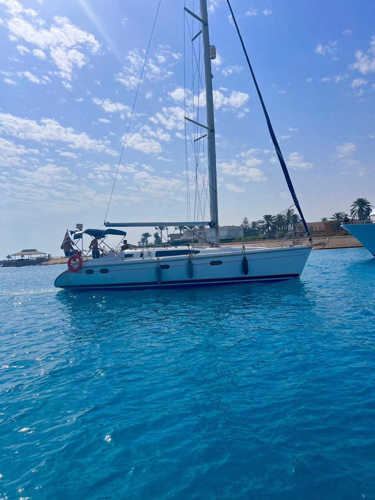 Porto Marina: viaje privado en velero Andiamo en la costa norte