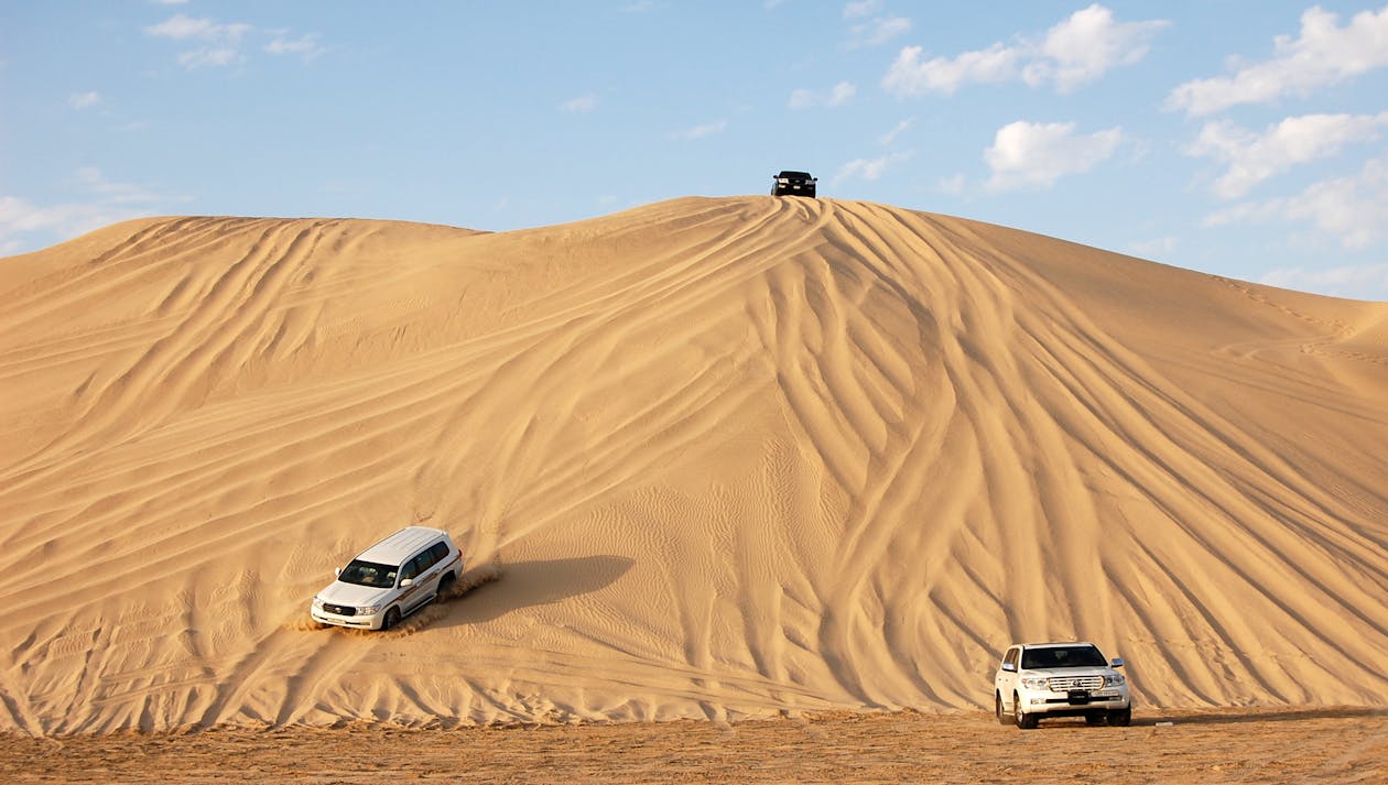 Doha: Desert Safari with Camel Ride, Dune Bashing, and Sandboarding Inland Sea Trip