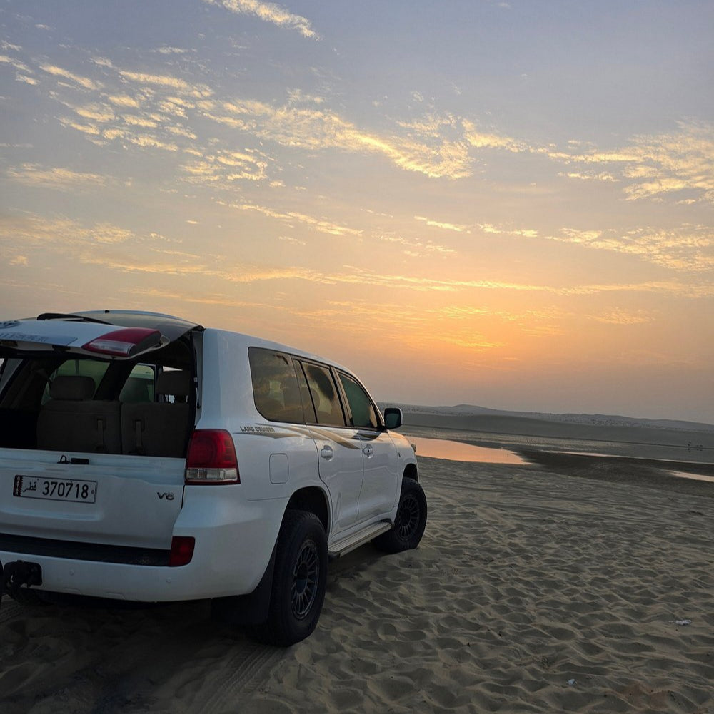 Doha: Sunrise or Sunset Desert Safari Dune Bashing, Camel Ride, and Inland Sea Views