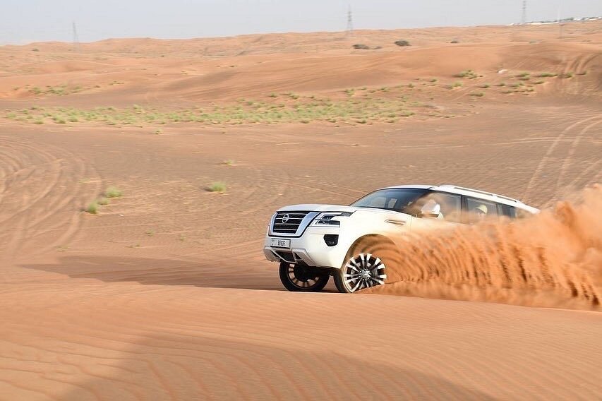 Dubai: Sunrise Desert Safari with Dune Bashing, Camel Ride and Sandboarding