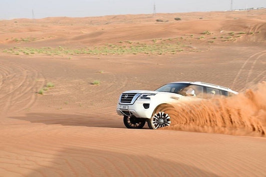 Dubai: Sunrise Desert Safari with Dune Bashing, Camel Ride and Sandboarding