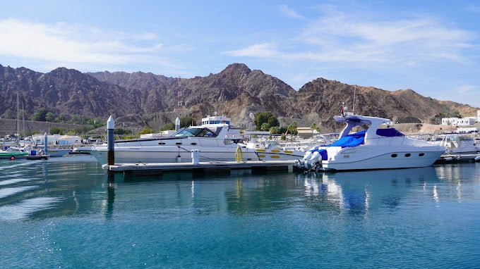 Muscat: Sunset Boat Cruise with Coastal and Mountain Views