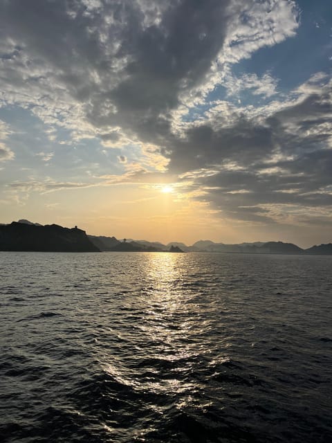 Muscat: Sunset Boat Cruise with Coastal and Mountain Views