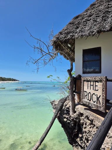 Zanzibar: Full - Day Mnemba Atoll, Dolphin Swim, Jozani Forest, and The Rock Restaurant Tour