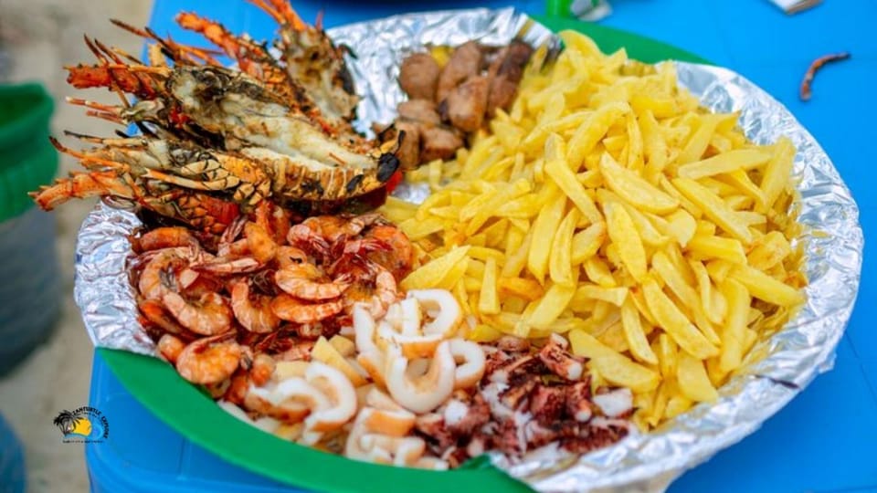 Zanzibar: Mnemba Island Dolphins and Sunset Dhow Cruise with Lunch