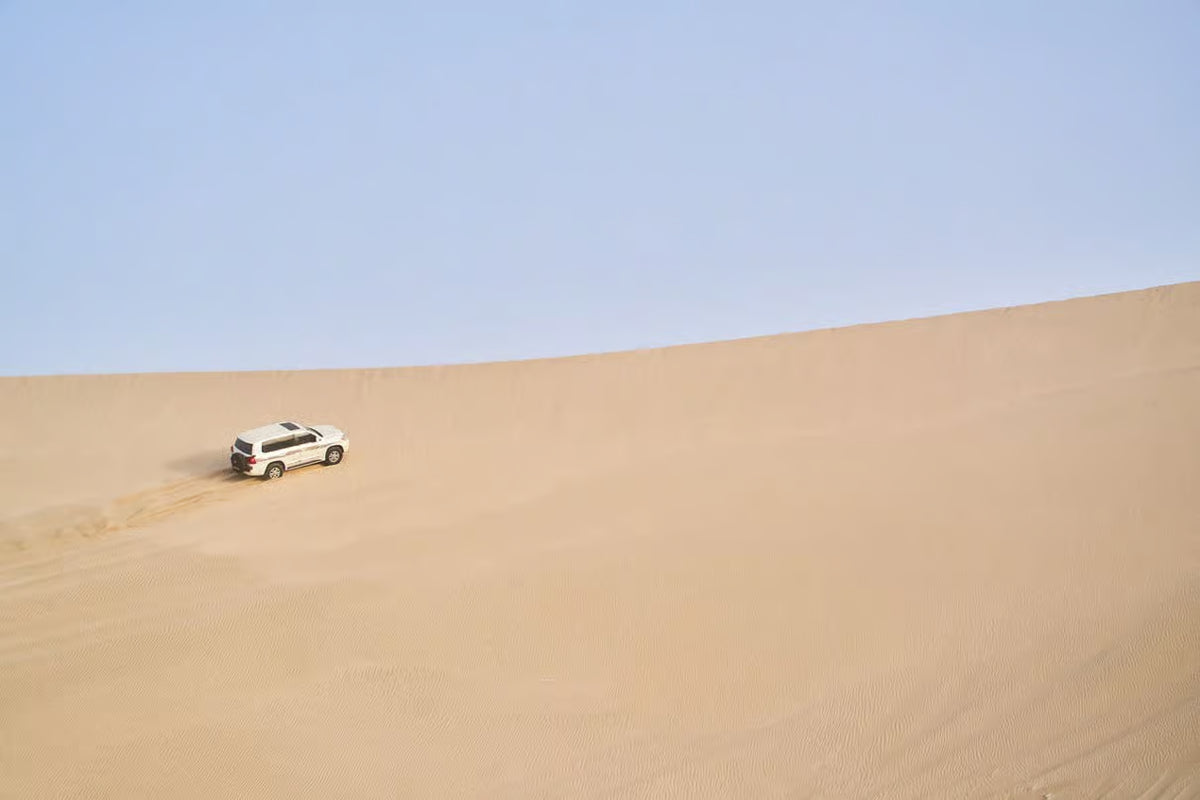 Doha: Desert Safari, Sandboarding and Mina District Tour