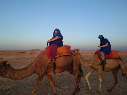 From Marrakech: giro in cammello al tramonto nel deserto di Agafay