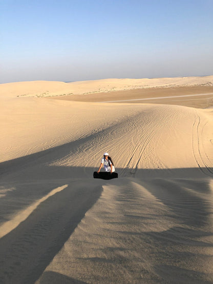 Doha: Desert Camp Day Use, Optional Safari, Sandboarding, and Camel Ride Tour