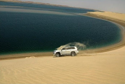 Doha: Overnight Desert Safari at Khor Al Adaid with Camel Ride and BBQ Dinner