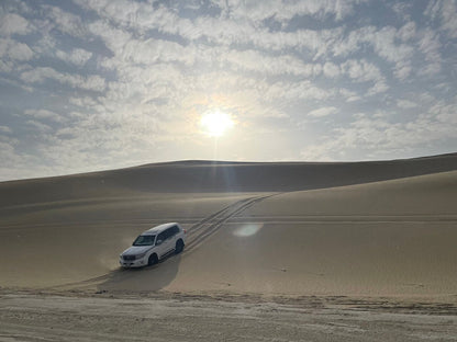 Doha: Shared Desert Safari with Dune Bashing and Sandboarding