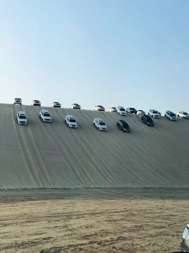 Doha: Sunrise Desert Safari with Sandboarding and Camel Ride