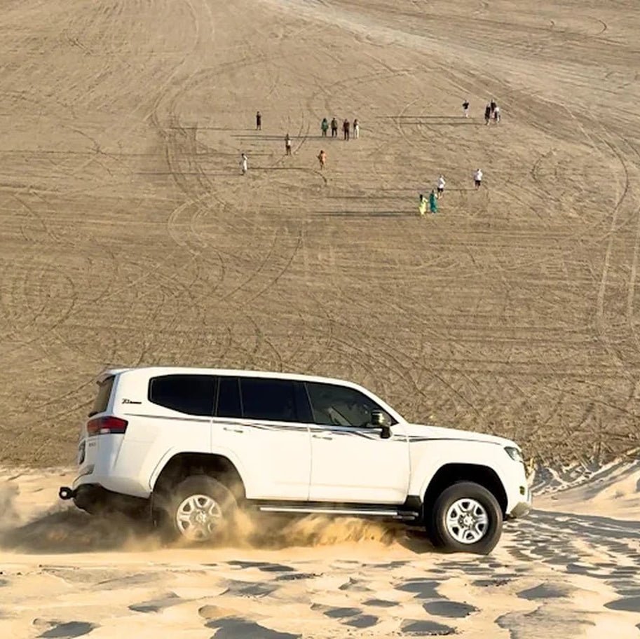 Doha: Sunrise Desert Safari with Sandboarding and Camel Ride