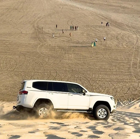 Doha: Sunrise Desert Safari with Sandboarding and Camel Ride