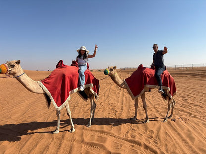Dubai: Morning Red Dunes Safari with Camel Ride, Sandboarding and Falcon Photo