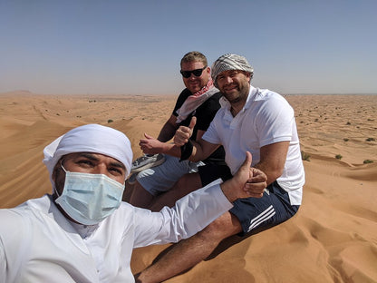 Dubai: Sunrise Desert Safari with Dune Bashing, Camel Ride and Sandboarding