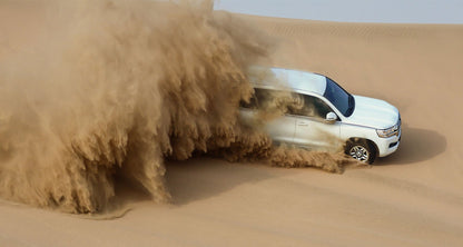 Doha : utilisation d'une journée dans un camp dans le désert, safari en option, sandboard et balade à dos de chameau