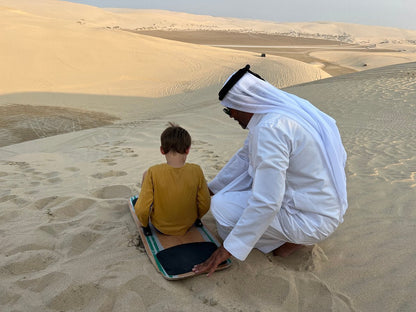 Doha : utilisation d'une journée dans un camp dans le désert, safari en option, sandboard et balade à dos de chameau