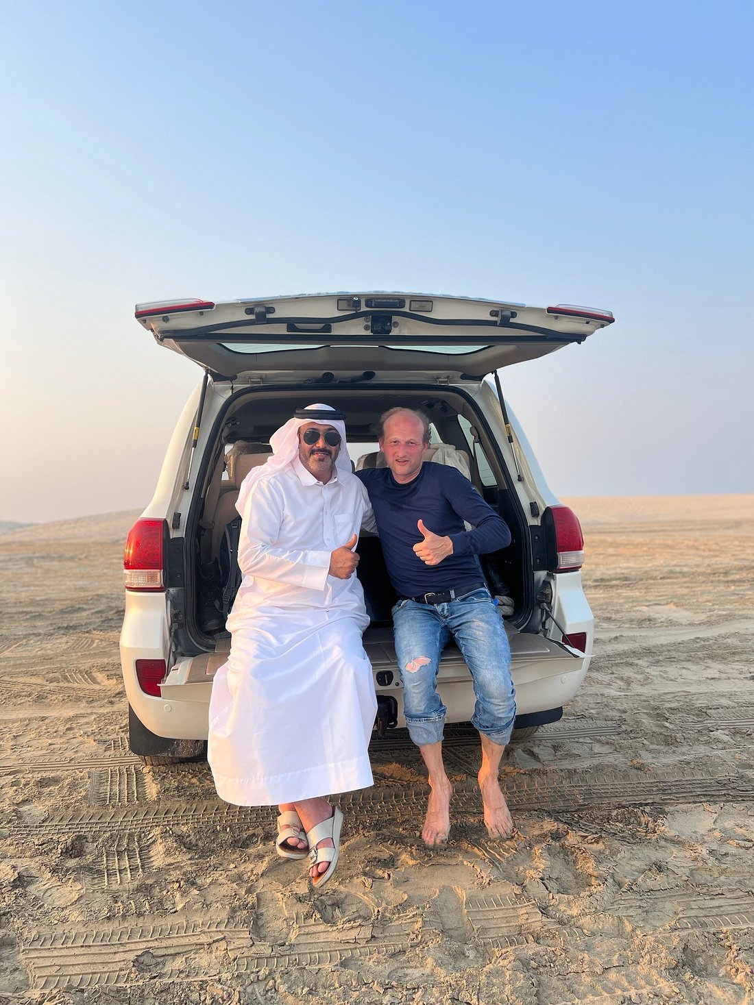 Doha : utilisation d'une journée dans un camp dans le désert, safari en option, sandboard et balade à dos de chameau