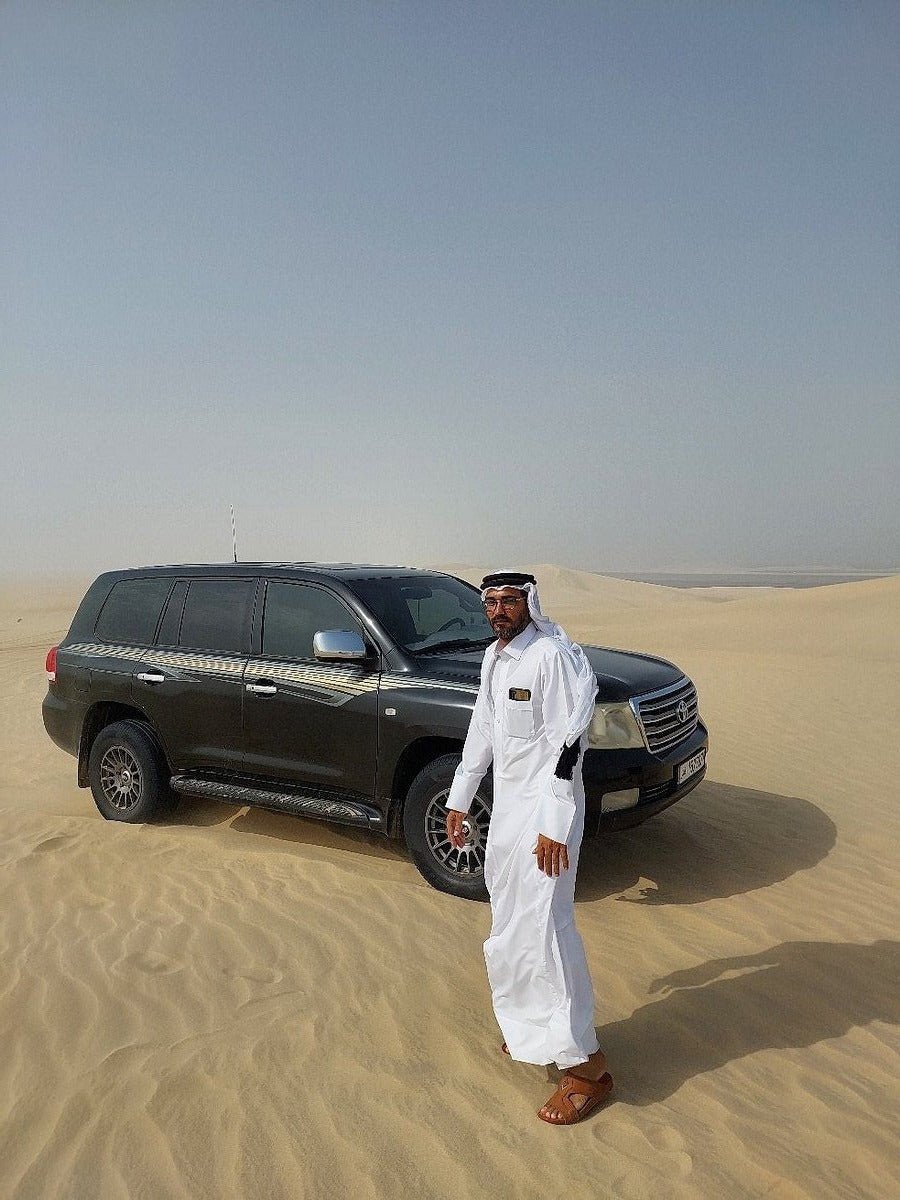 Doha : utilisation d'une journée dans un camp dans le désert, safari en option, sandboard et balade à dos de chameau